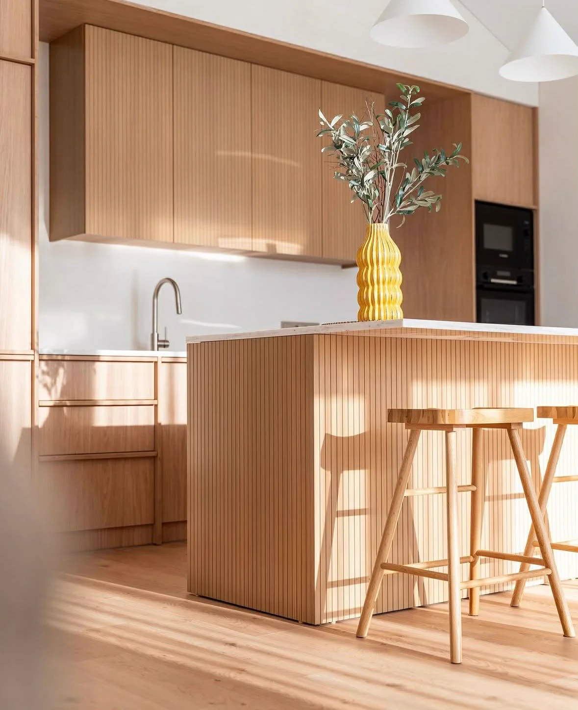 Completed custom oak kitchen and fitted island delivered through GDiT's furniture capability